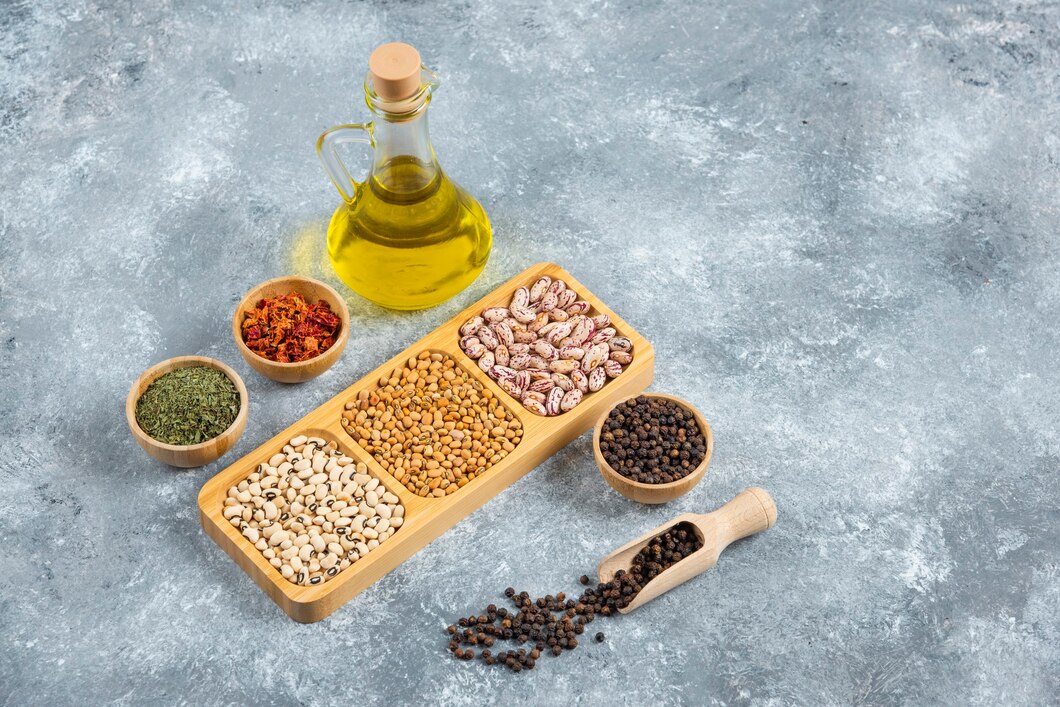 Foods rich in vitamin E including almonds, sunflower seeds, avocados, and olive oil